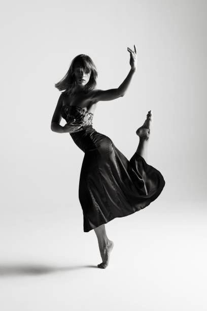 istock Young beautiful ballerina is posing in studio 1014274964