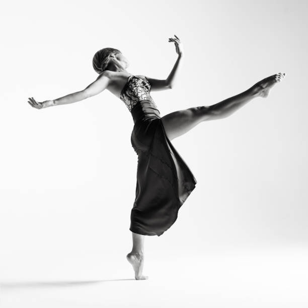 istock Young beautiful ballerina is posing in studio 1014275796