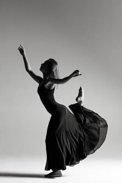 istock Young beautiful ballerina is posing in studio 1014275862