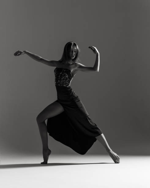 istock Young beautiful ballerina is posing in studio 1014276080