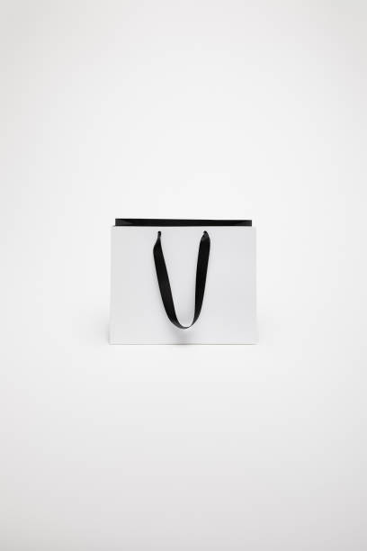 istock one black and white paper shopping bag isolated on white 1014276746