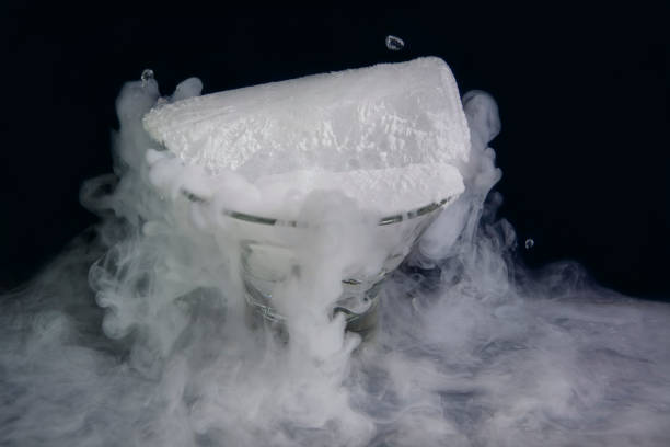 Dry Ice Smoking with vapor on dark background stock photo