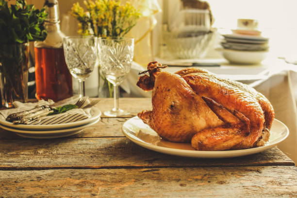 istock baked bird - a festive dish (laying on a wooden table). food background 1014281368