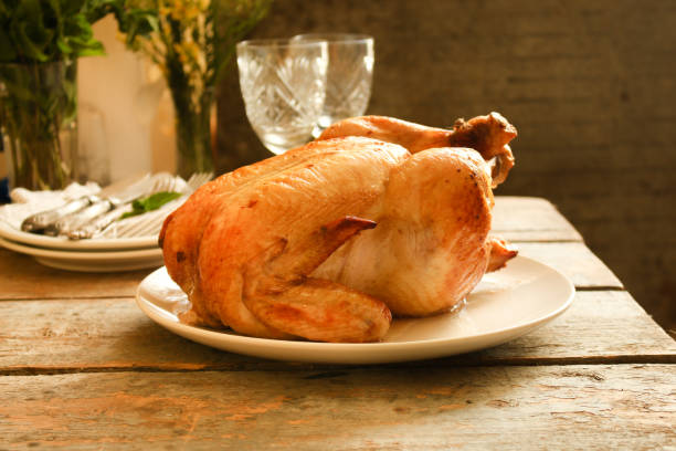 istock baked bird - a festive dish (laying on a wooden table). food background 1014281566
