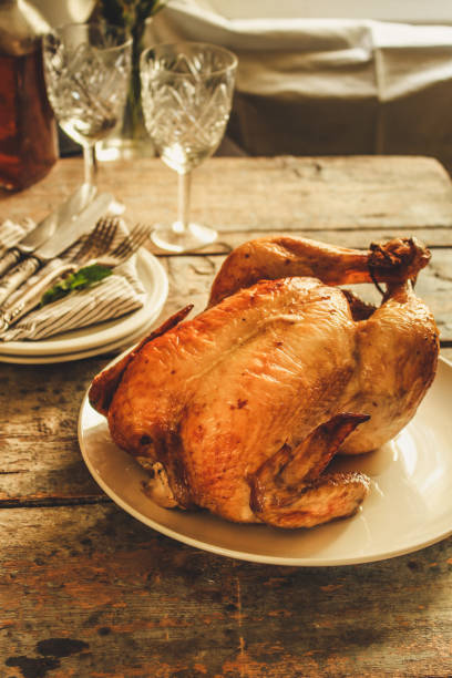istock baked bird - a festive dish (laying on a wooden table). food background 1014281572