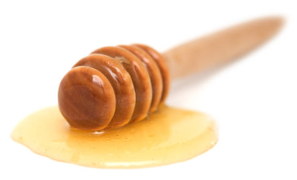 istock Wooden honey dipper 1014287526