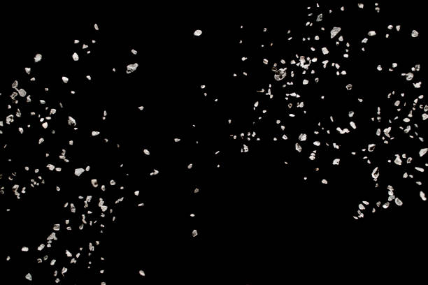 istock Split debris of stone caused by explosion against black background. 1014287778