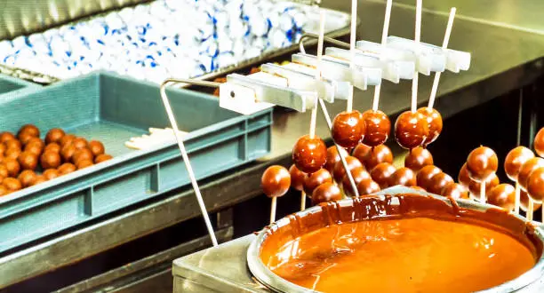 Salzburg, Austria . An old photo showing the details of the production of the famous Austrian sweets "Mozart" in 19th centure. The Mozartkugeln, is a small, round sugar confection made of pistachio marzipan, and nougat, covered with dark chocolate. It was originally known as Mozart-Bonbon