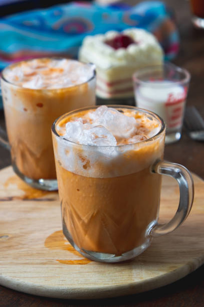istock thai tea milkshank sweet drink on the glass for refreshment 1014290832