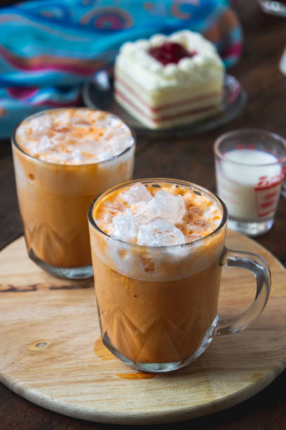 istock thai tea milkshank sweet drink on the glass for refreshment 1014290958