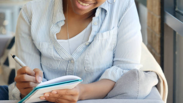 istock Woman journals on a relaxing day 1014291676