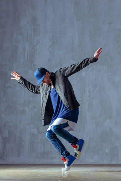 istock Young beautiful male dancer posing in studio 1014298072