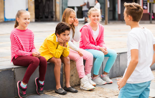 istock Kids talking on city walk 1014298164