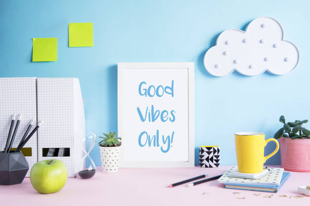 istock Stylish and modern workspace with mock up poster frame, office accessories, memo sticks, cup of coffee, notebooks and cloud. Design space of home office. 1014308668