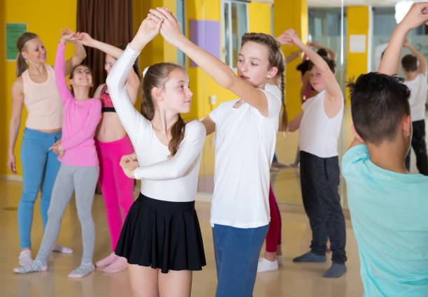 istock Children dancing rock-and-roll in pairs 1014309208