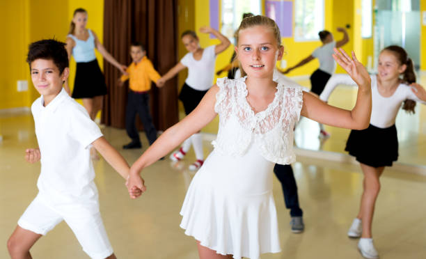 istock Boys and girls enjoying active dance 1014312414