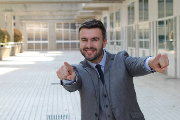 istock Confident businessman pointing at camera 1014312572