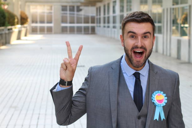 empresário, orgulhoso do seu prêmio de fita - second place ribbon award suit - fotografias e filmes do acervo