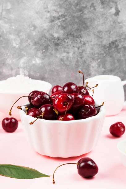 istock Ingredients for cherry pie on a pink background 1014318950
