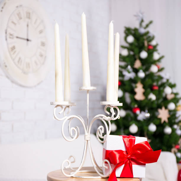 istock candles in vintage candlestick in Christmas interior 1014321790