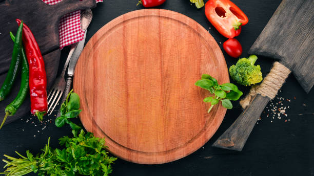 istock Kitchen board with fresh vegetables. On a wooden table. Top view. Free space for text. 1014324674