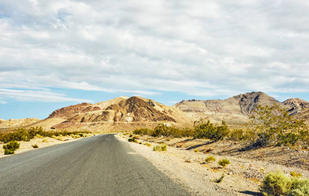Road to Desert and Mountains near Beatty Nevada stock photo