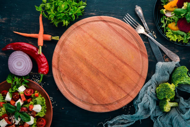 istock Kitchen board with fresh vegetables. On a wooden table. Top view. Free space for text. 1014326906