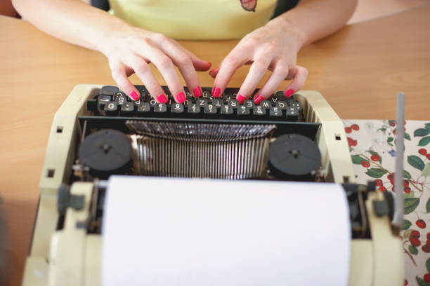 istock Young woman typing with a typewriter 1014326930