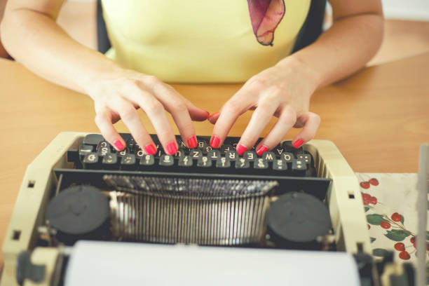 istock Young woman typing with a typewriter 1014342424