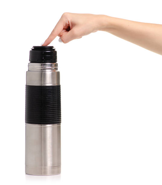 istock Thermos bottle metal in hand 1014345496