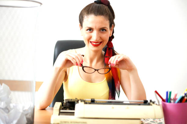 istock Young woman typing with a typewriter 1014345788