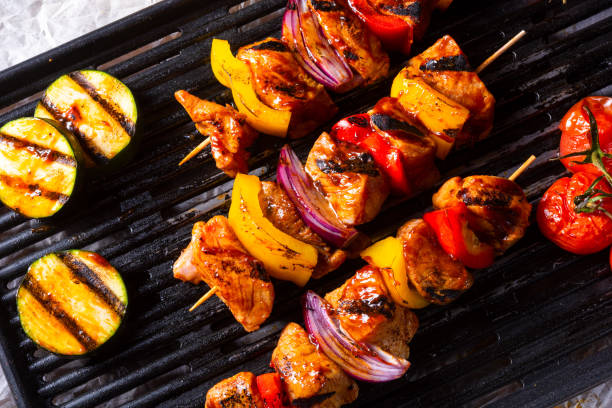 istock Rustic shish kebab skewers with marinated ham meat paprika and red onion 1014351654