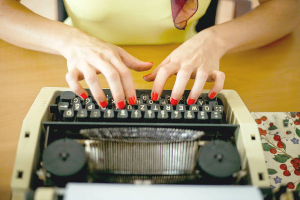 istock Young woman typing with a typewriter 1014354914
