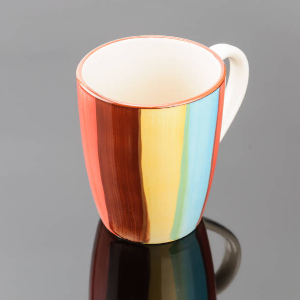 istock Coffee tea porcelain clay mug on the grey mirror background 1014363524