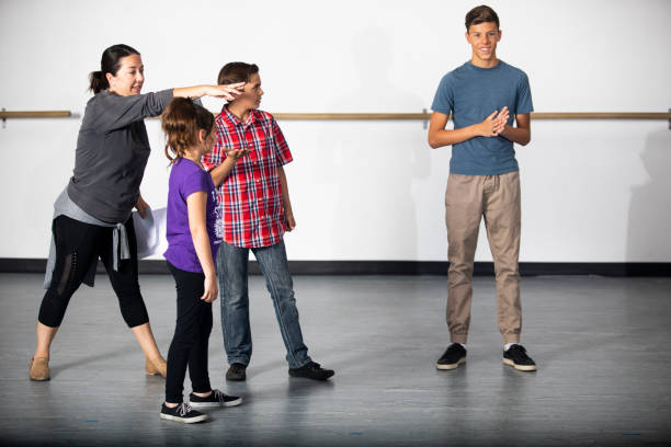 istock Diverse Group of Drama Students Receive Instruction from Director 1014363684