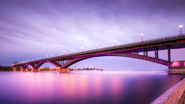 Peace Bridge Peace Bridge is an international bridge connecting the United States and Canada. Located at the east end of Lake Erie, the source of the Niagara River, about 20 kilometres upriver of Niagara Falls. It is operated and maintained by the binational Buffalo and Fort Erie Public Bridge Authority. Edward Lupfer served as chief engineer. lake erie stock pictures, royalty-free photos & images