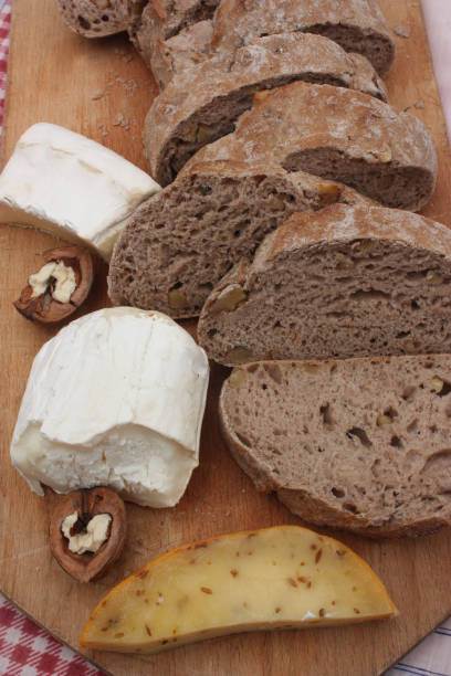 istock Bread sliced with walnuts  Cheese  Handcrafted product 1014371748