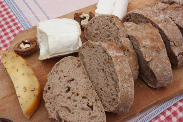 istock Bread sliced with walnuts  Cheese  Handcrafted product 1014371942