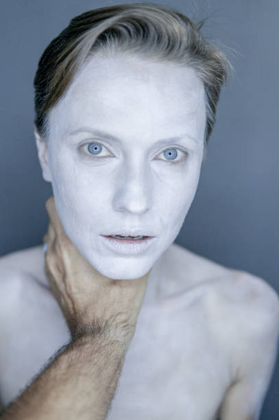 istock Woman with hand over neck 1014385972