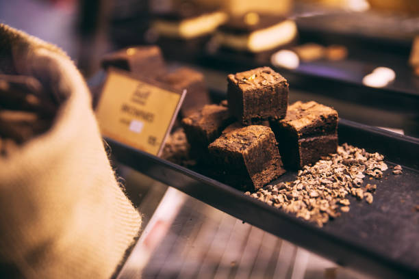 istock Cube brownies on black tray in the shelf that ready for sell. 1014386642