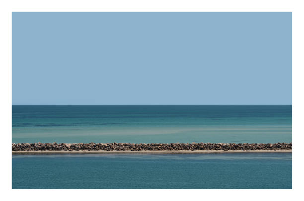 istock Blue waterscape of Adelaide port's breakwater. 1014389926