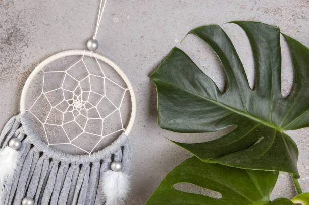 istock Gray beige dream catcher on gray 1014392462