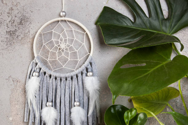 istock Gray beige dream catcher on gray 1014399850