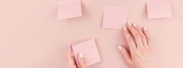 istock Woman hands with paper stickers 1014413378