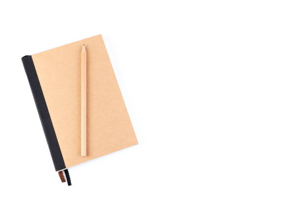 istock Top view cover note book with cream with pencil placed on white background, space for letter type. Isolated , Copy space. 1014413668
