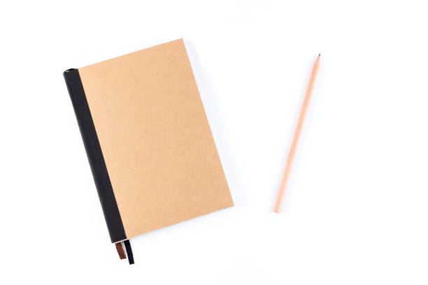 istock Top view cover note book with cream with pencil placed on white background, space for letter type. Isolated , Copy space. 1014413742