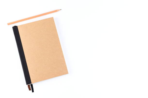 istock Top view cover note book with cream with pencil placed on white background, space for letter type. Isolated , Copy space. 1014413772