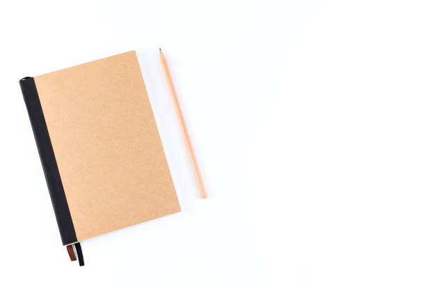 istock Top view cover note book with cream with pencil placed on white background, space for letter type. Isolated , Copy space. 1014413774