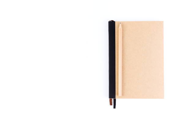 istock Top view cover note book with cream with pencil placed on white background, space for letter type. Isolated , Copy space. 1014413814