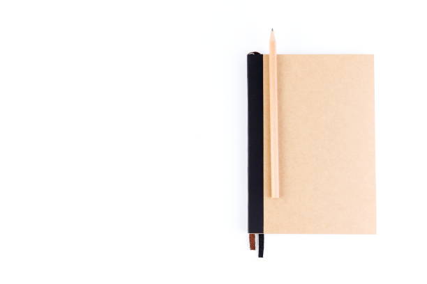 istock Top view cover note book with cream with pencil placed on white background, space for letter type. Isolated , Copy space. 1014413824